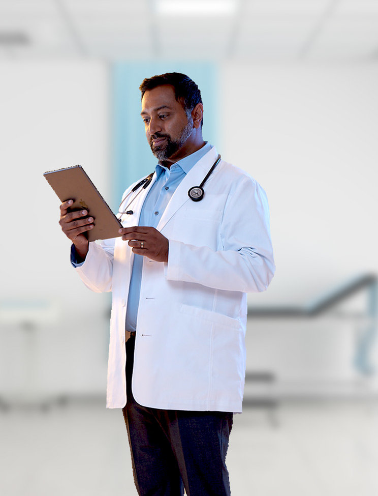 A doctor looking at his tablet